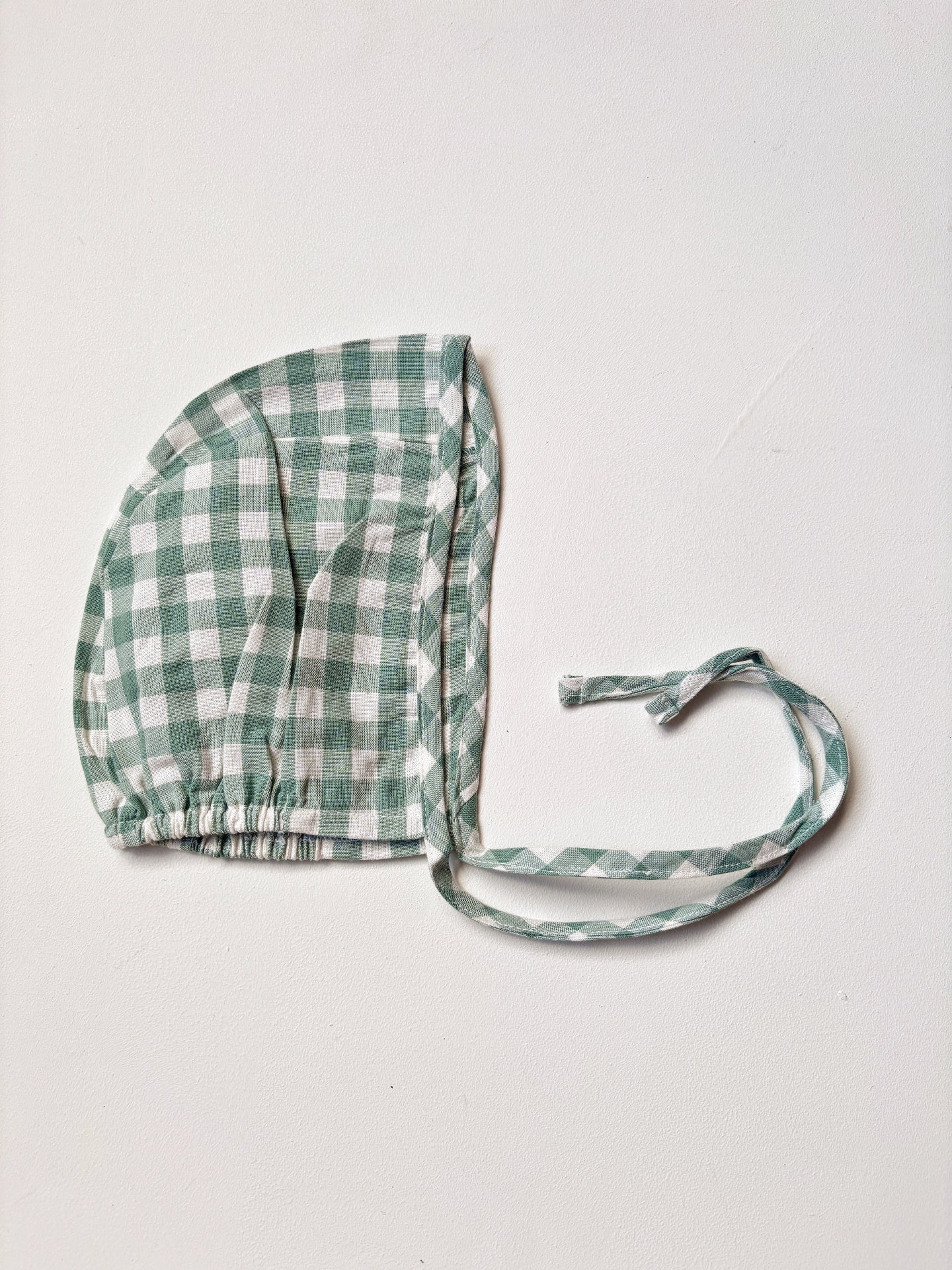 image shows organic cotton baby bonnet