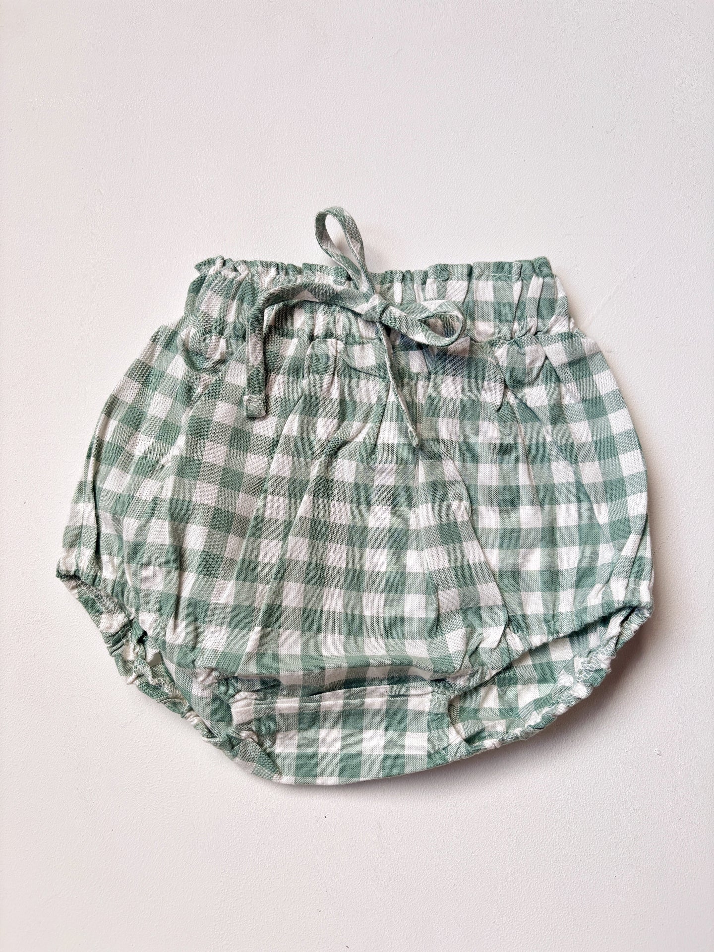image shows organic cotton gingham baby bloomers