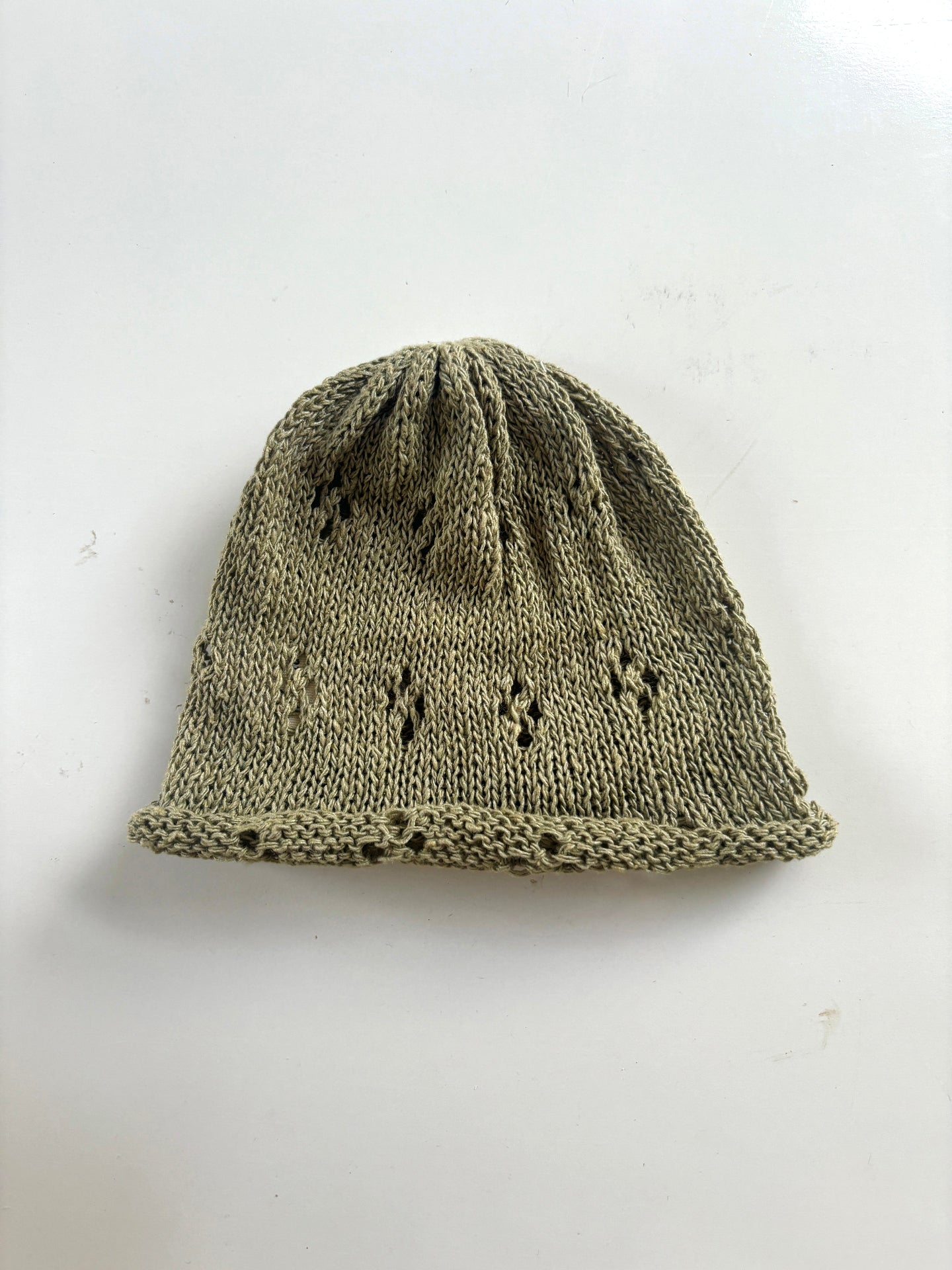 image shows natural organic hand made coriander green sudha baby hat