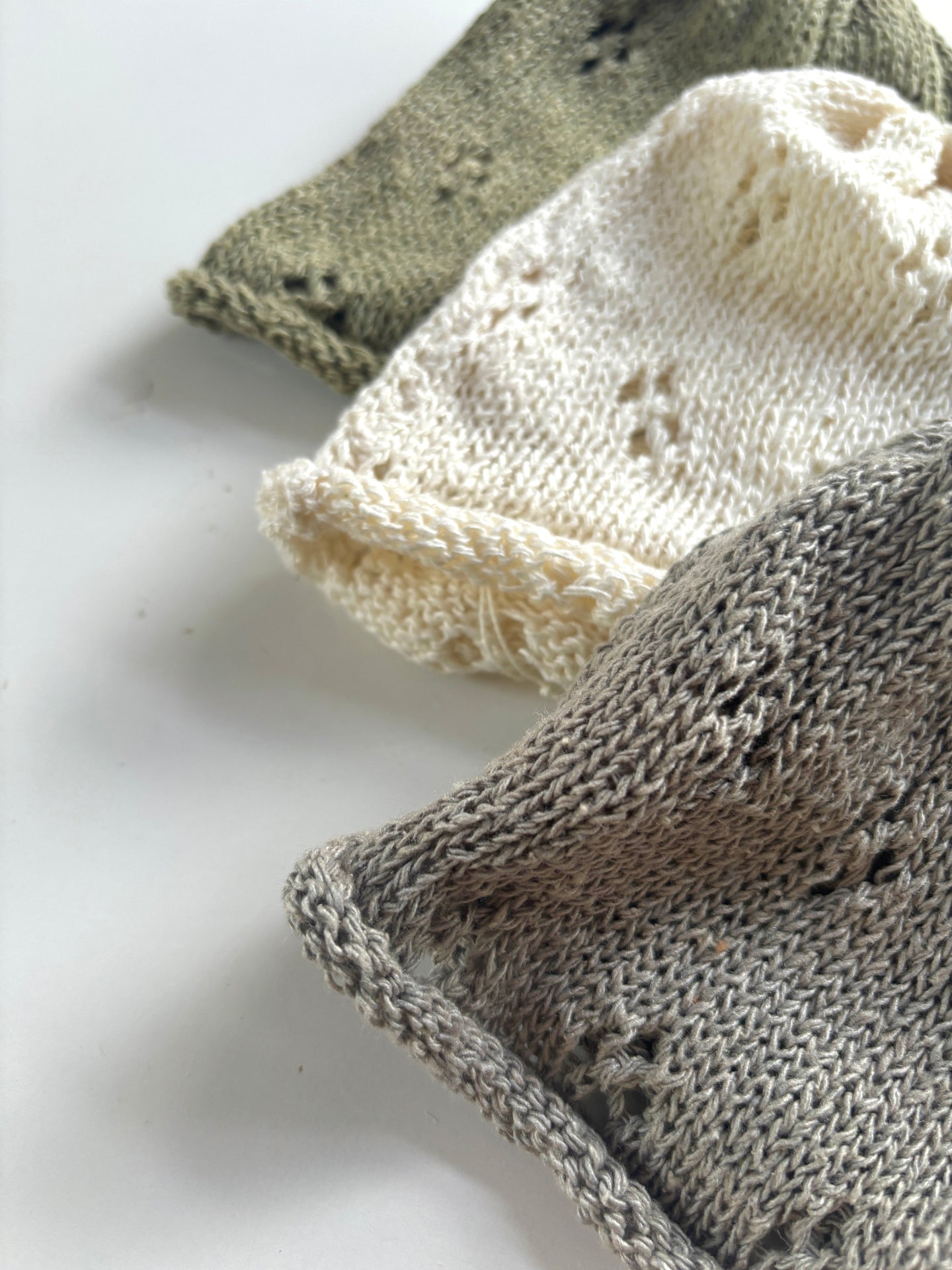 image shows details of natural silk baby hats